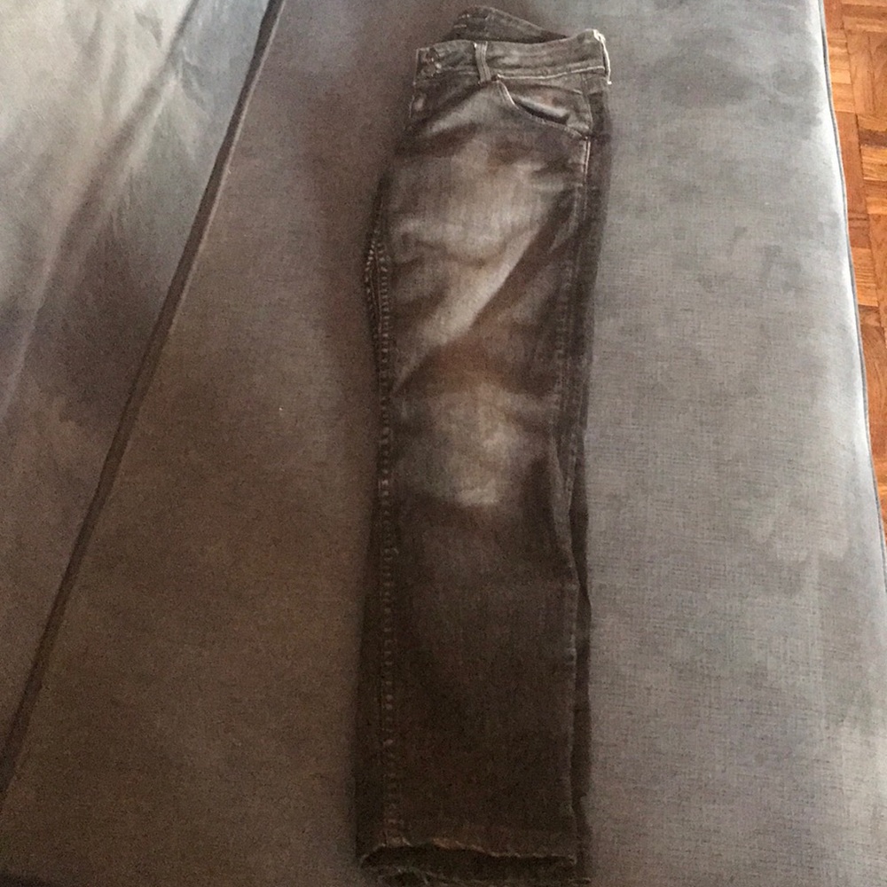 Dark blue distressed denim jeans